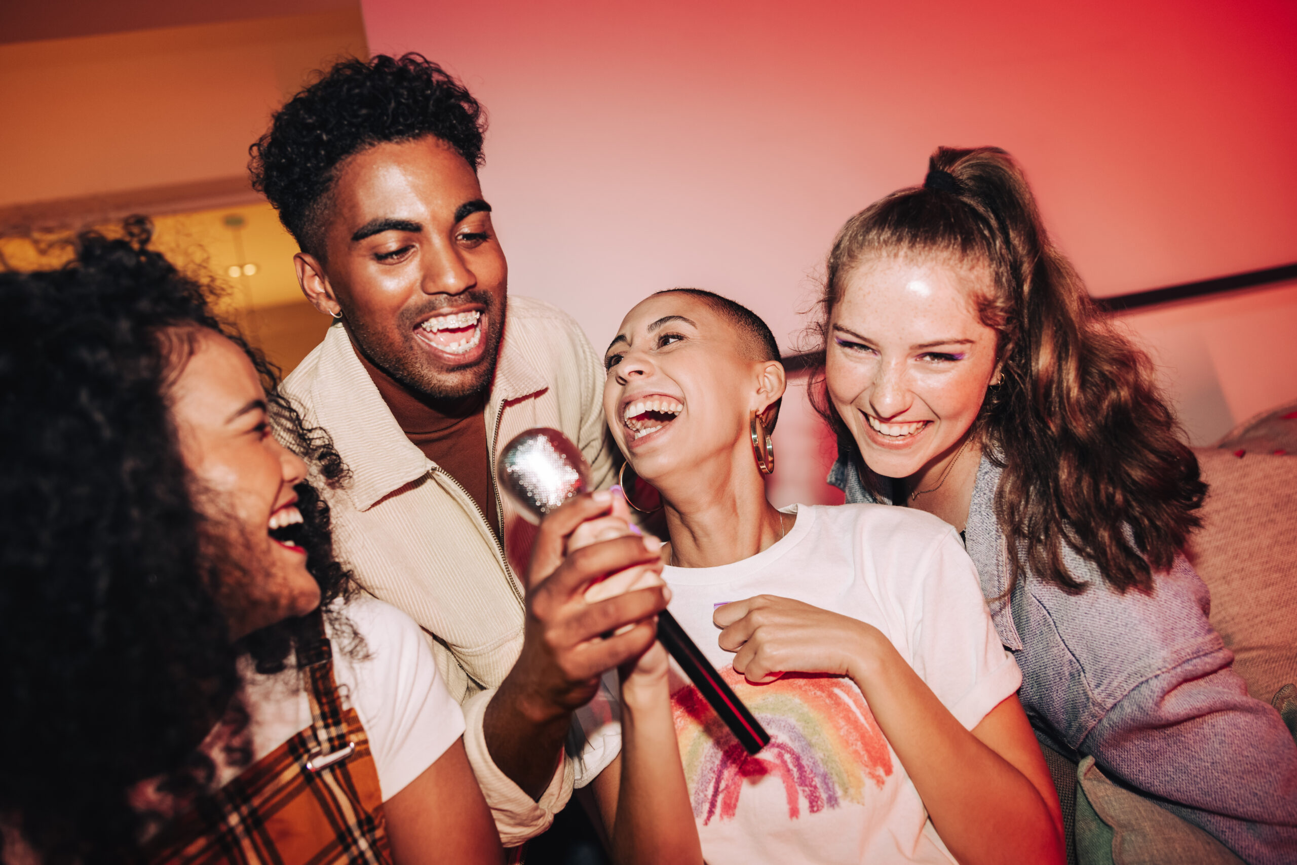 vibrant friends enjoying karaoke night together